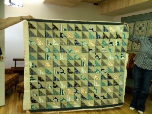 I cannot remember who's behind this quilt - it is magnificent though!! Perfect points for sure! Challenge accepted and accomplished!